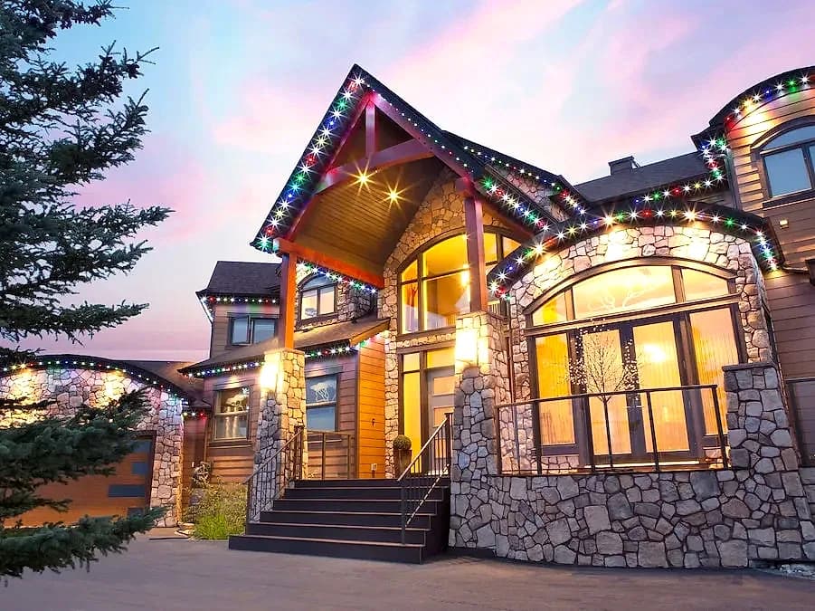Multicolour roofline, stone and timber, lit after dark