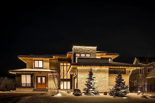 Warm roofline in winter, lit after dark